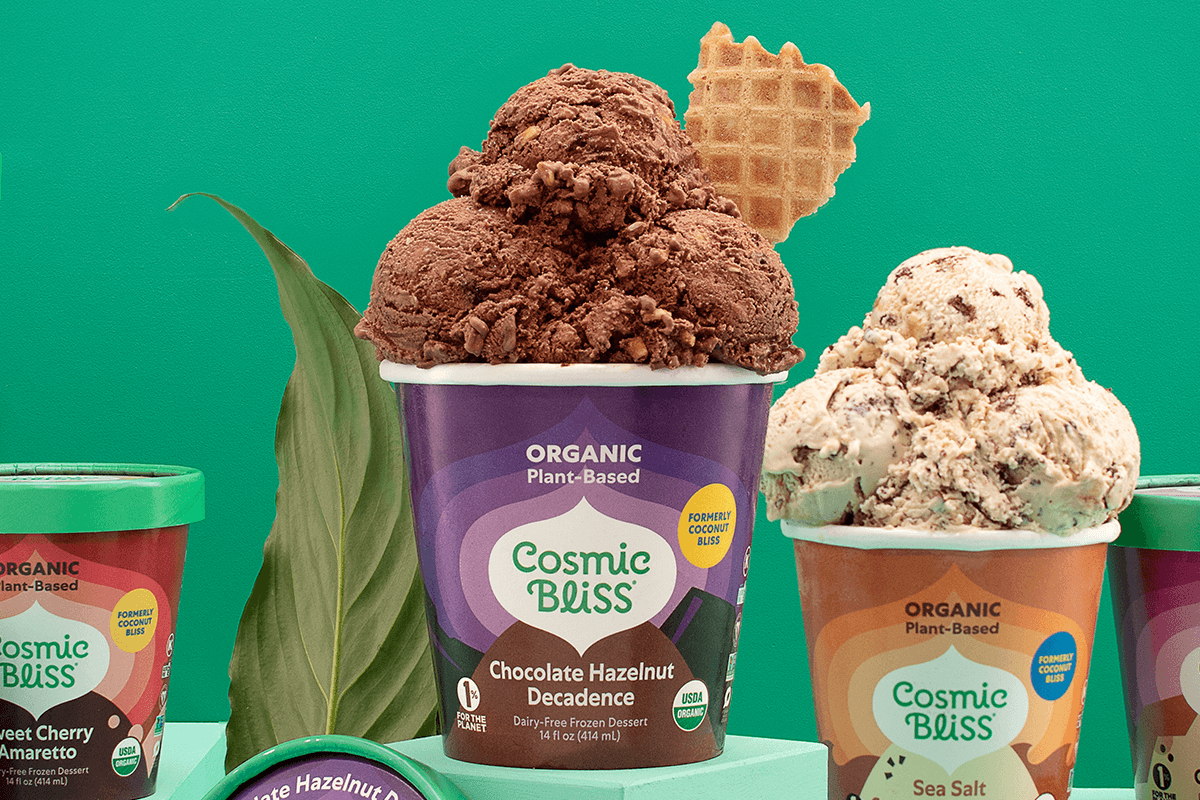 an array of plant based ice cream pints with ice cream scoops coming out of the top of the pint. 